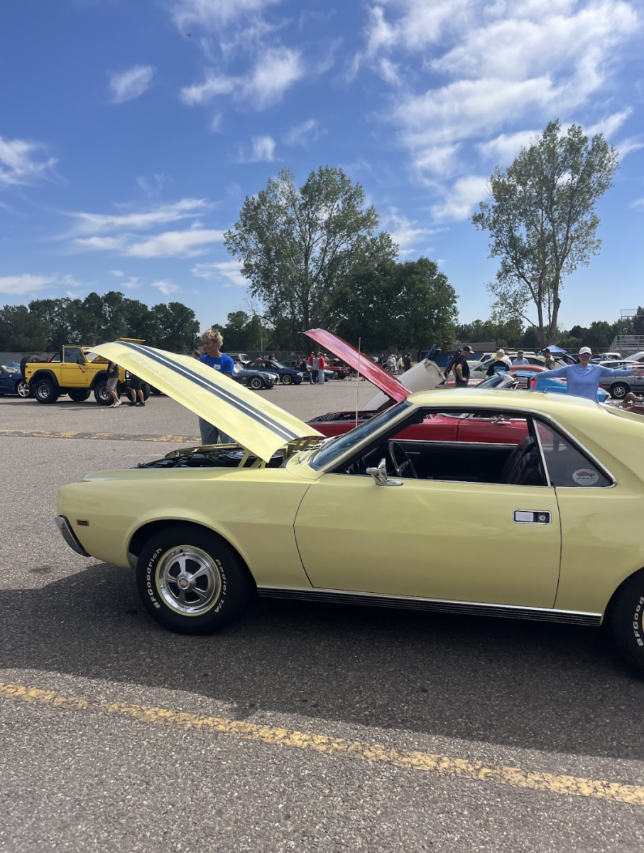 Cars line up at the DECA Car Show